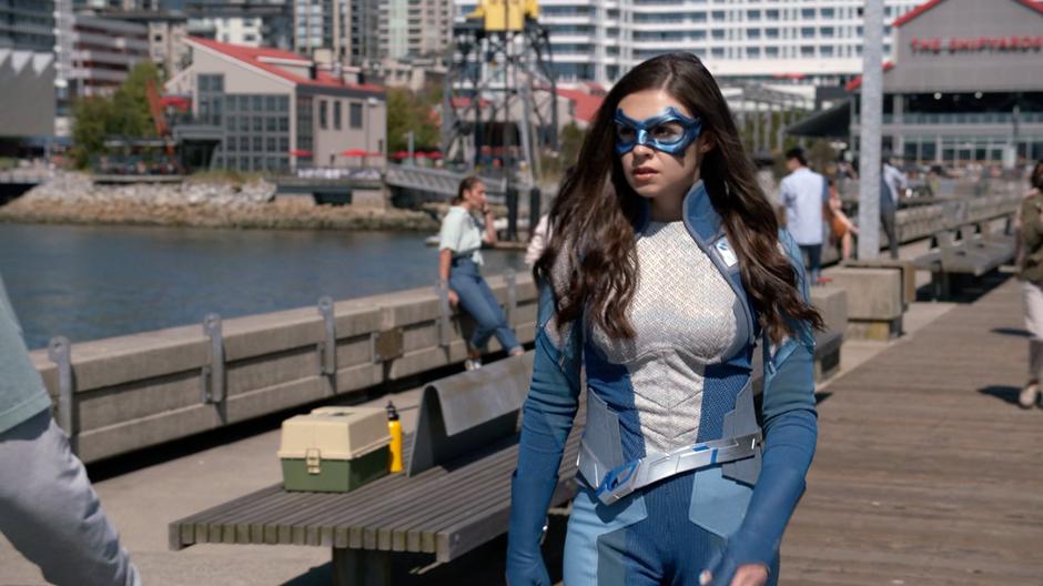 Nia walks down to the end of the pier looking for somewhere to make her stand.