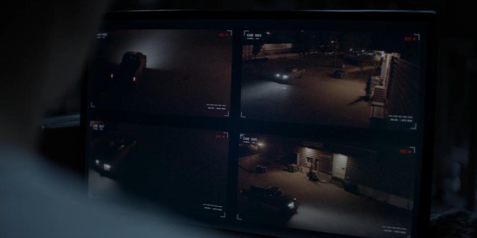 Luke and Kate watch security footage of the Executioner's truck outside the warehouse.