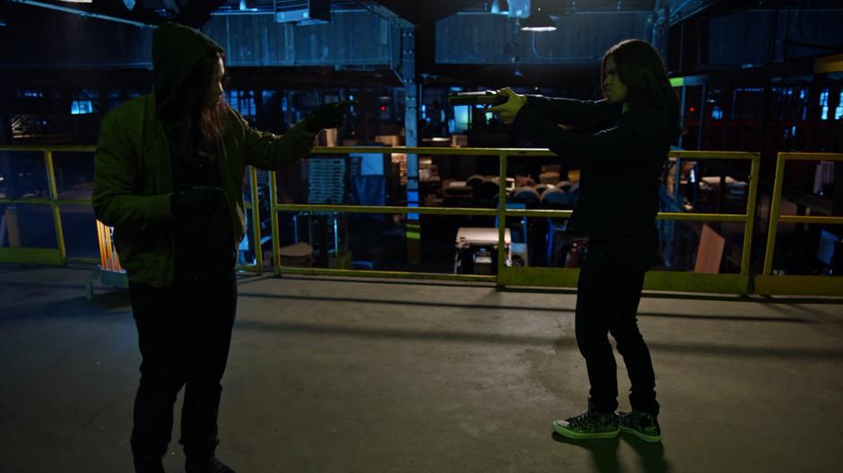 Cisco circles Echo while holding at gunpoint using the weapon that Echo used to kill Cynthia.