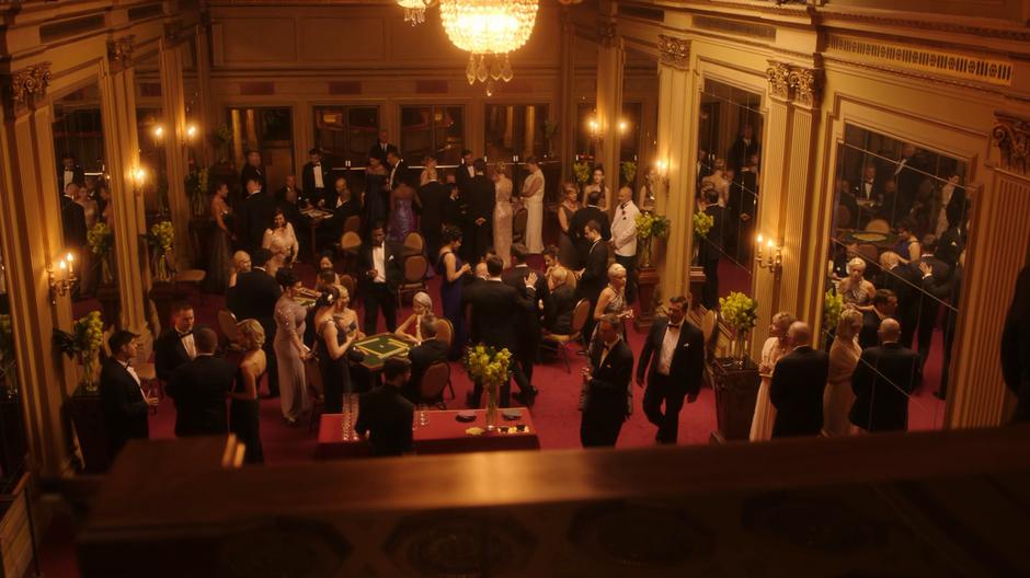 People mingle around and play mahjong in the VIP room.