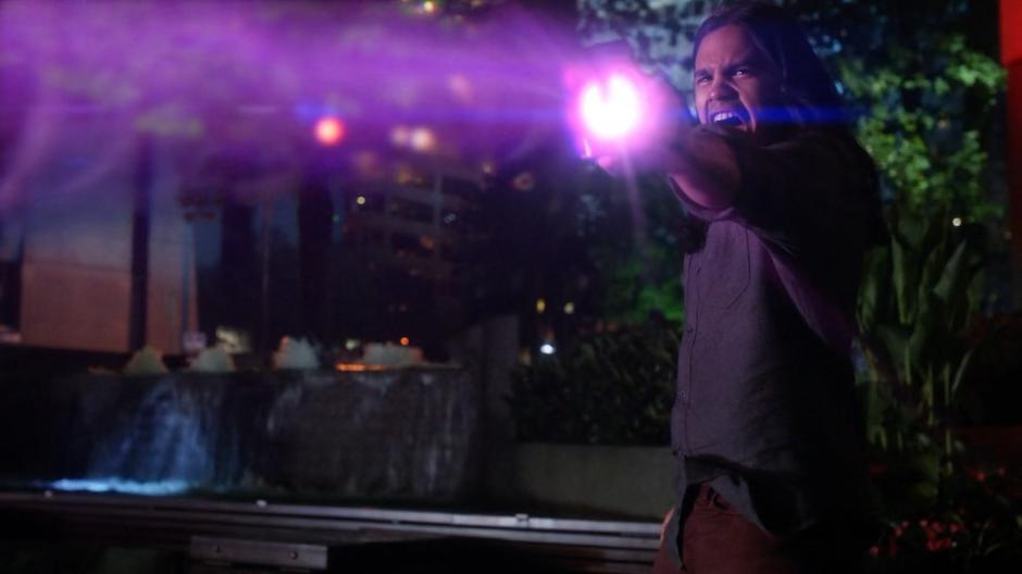 Cisco screams as he fires his experimental weapon at Ramsey.