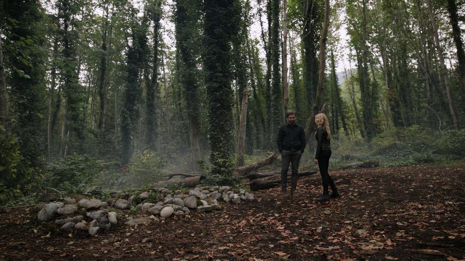 Oliver talks to Mia over the old graves of the people he lost on the island.