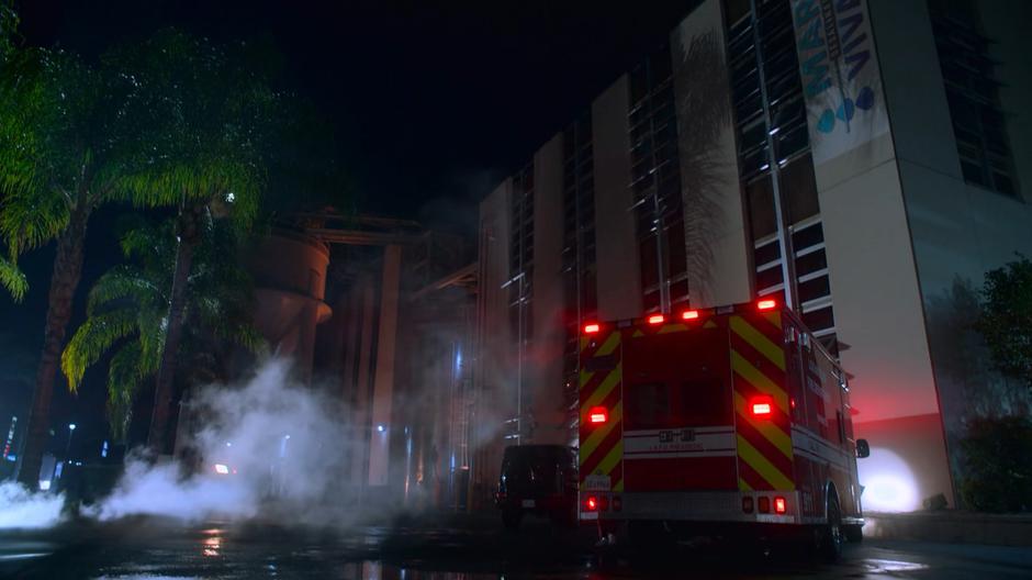 The Son's stolen ambulance stops in front of the building.