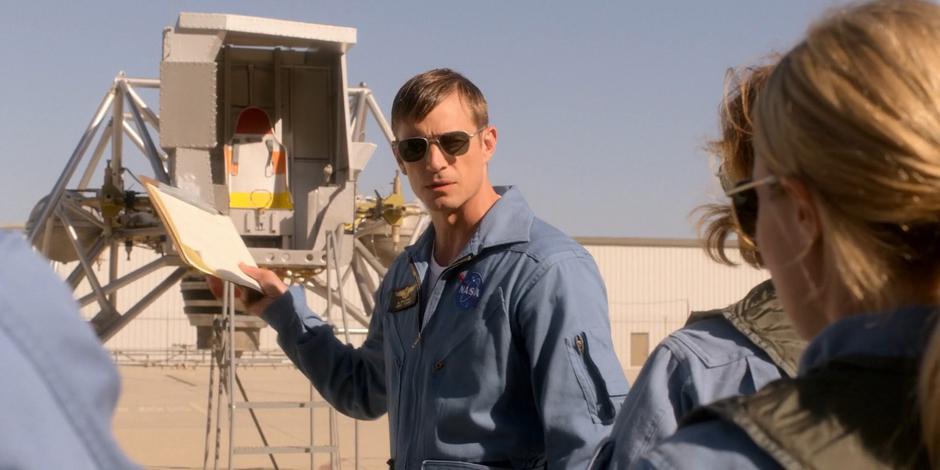 Ed gives the remaining ASCANs a briefing on the Lunar Landing Training Vehicle.