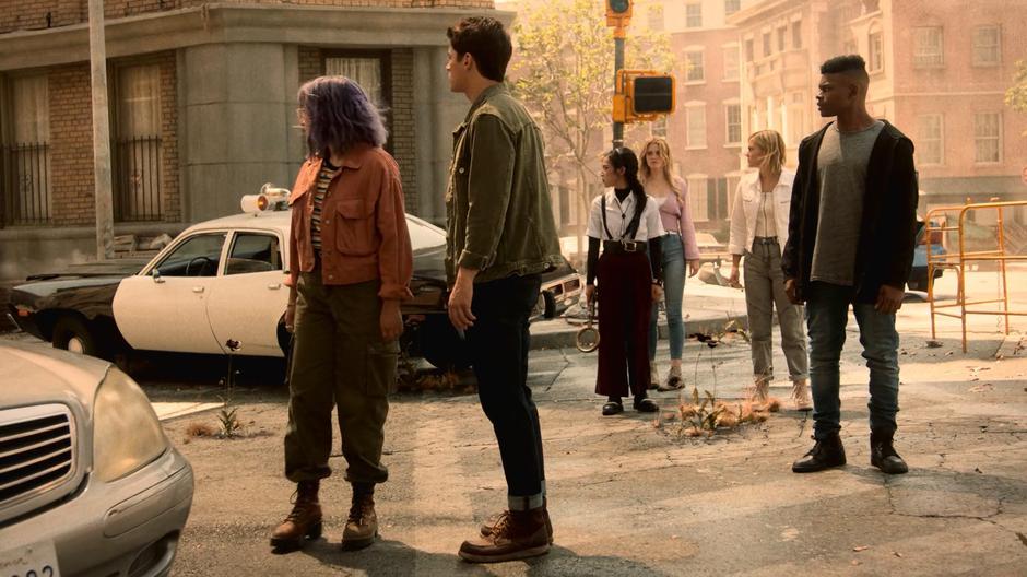 Gert, Chase, Nico, Karolina, Tandy, and Tyrone look around the desolate street.