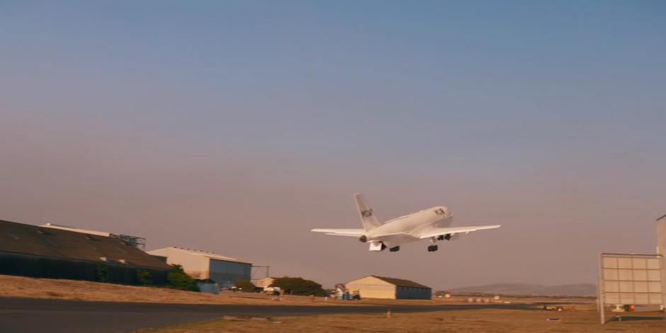 Daniel Barton's plane takes off as the cargo ramp closes.