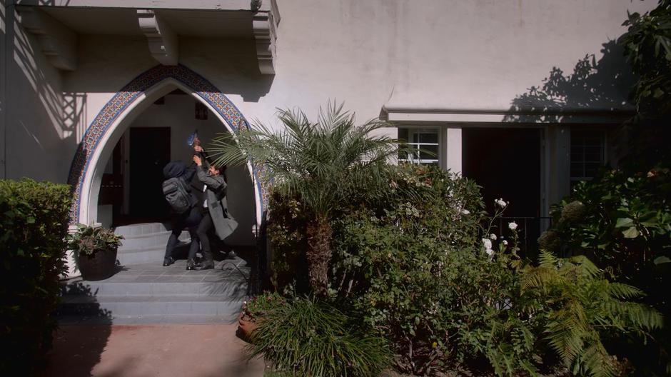 Future Alex and Chase fight over the gun on the front porch.