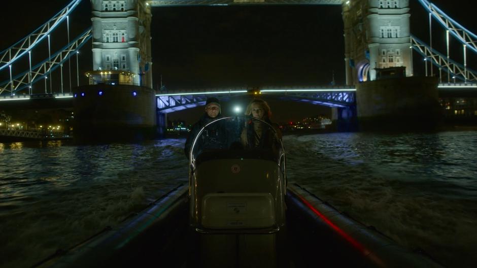 Linda rides in a Checquy boat past the Tower Bridge.