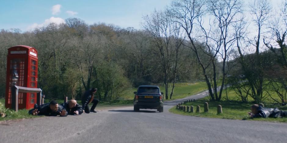 The goons stand back up as Ryan, Yaz, and Graham drive off in their car.