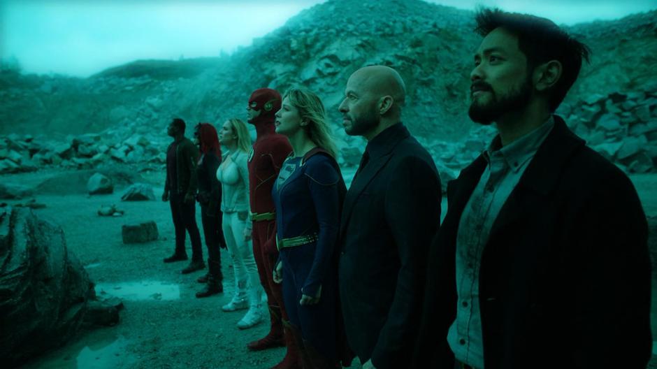 J'onn, Kate, Sara, Barry, Kara, Lex, and Ryan stare up at Oliver and send him good Paragon vibes.