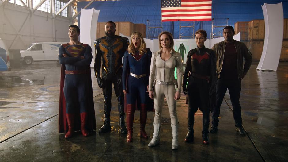 Clark, Jefferson, Kara, Sara, Kate, and J'onn watch Barry's table reveal. Kara is very excited.