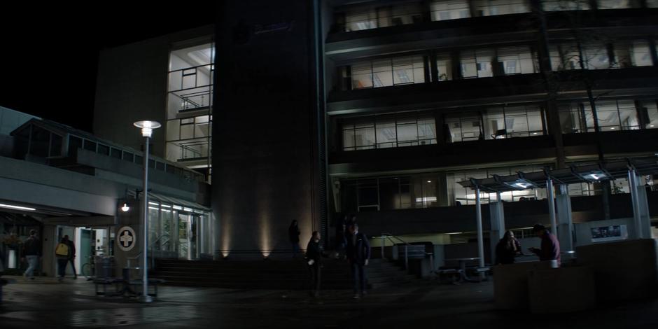 Mary runs up to her old professor Dr. Campbell as he leaves a late class.