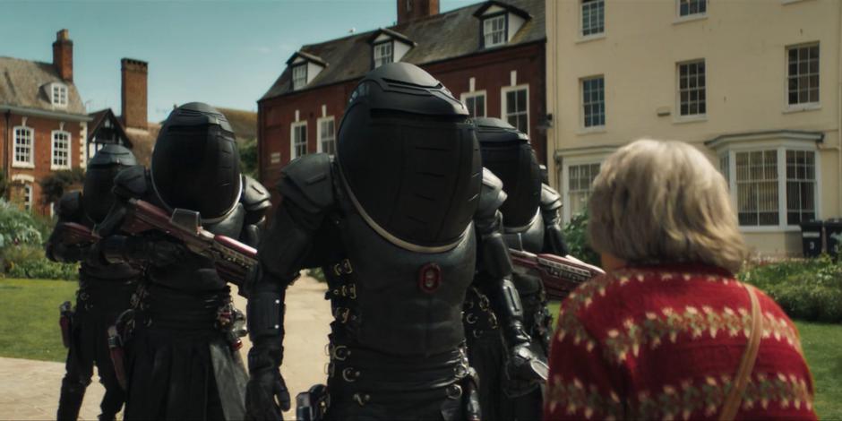 Marcia steps in front of the masked Judoon and tells them they can't do this.