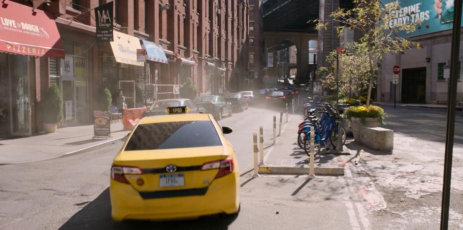 Molly tells the taxi driver to follow the three departing M.I.B. vehicles.