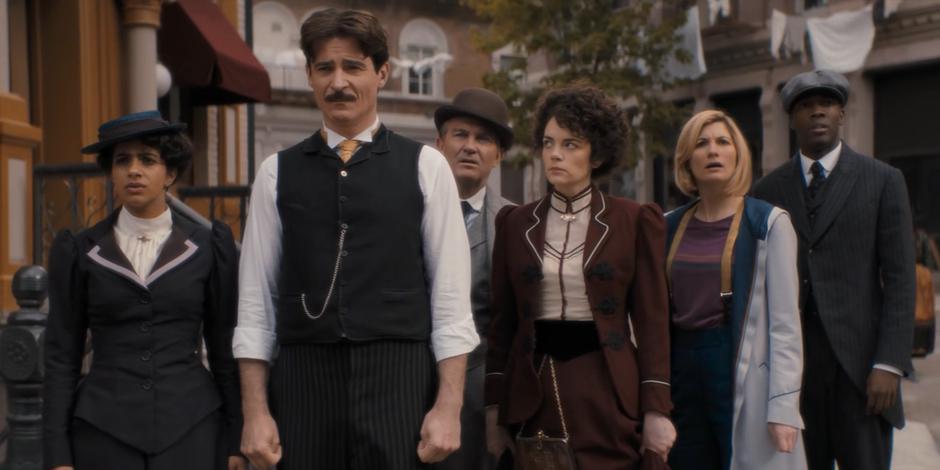 Yaz, Nikola Tesla, Graham, Dorothy Skeritt, the Doctor, and Ryan watch the protests in front of Tesla's lab.