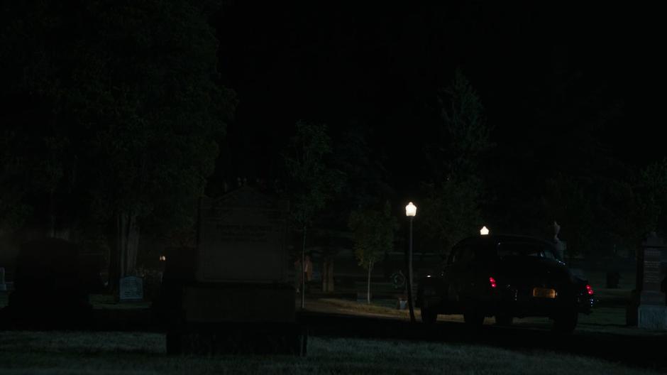 Officer Sullivan and Ray pull up in their police car.