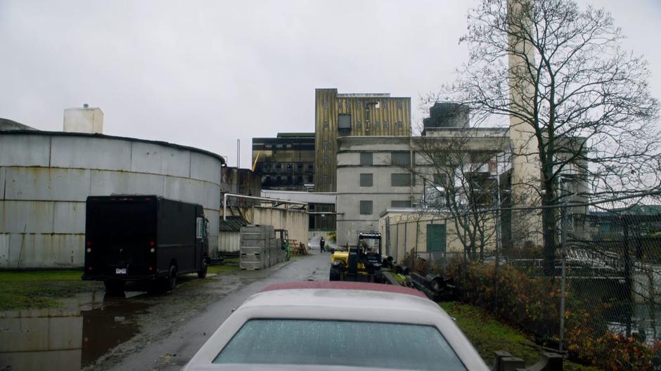 Ralph and Sue sit in their car watching the building from a distance.