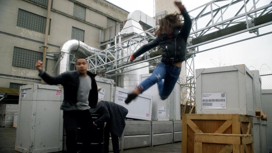 Sue hits the guard with a flying kick as he is trying to drown Ralph.