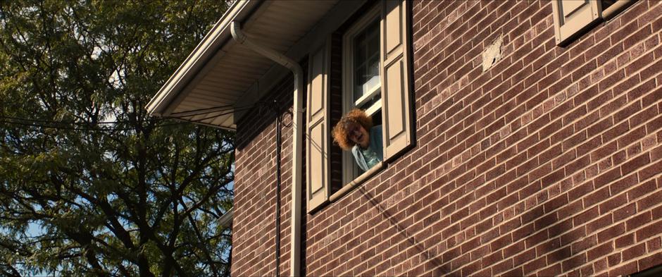 A woman yells from her window telling Spider-Man to back off.