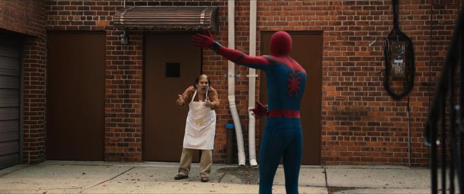 A man from a nearby restaurant steps outside to yell at Peter.