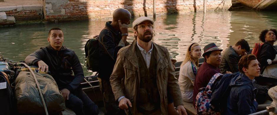 Mr Harrington, Betty, Ned, Peter, and the other students look up at the hotel.