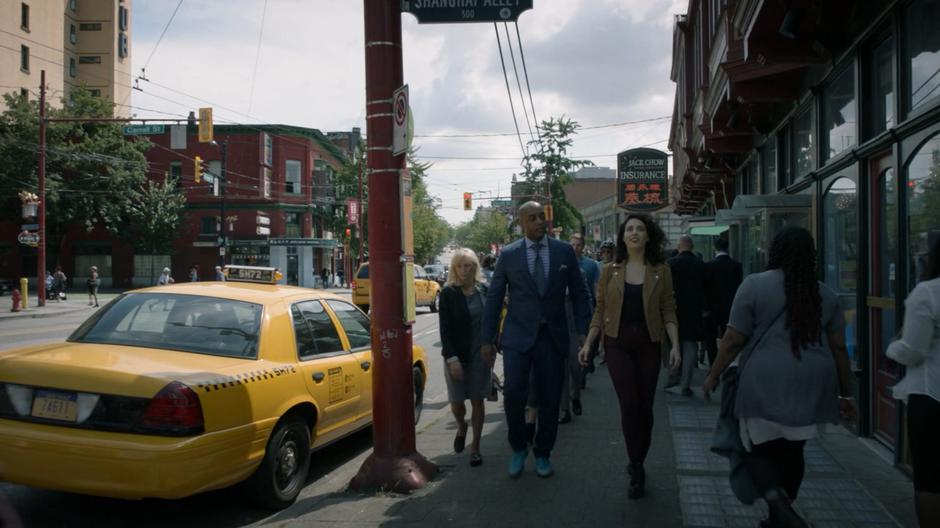 Fogg and Kady walk down the street while high.