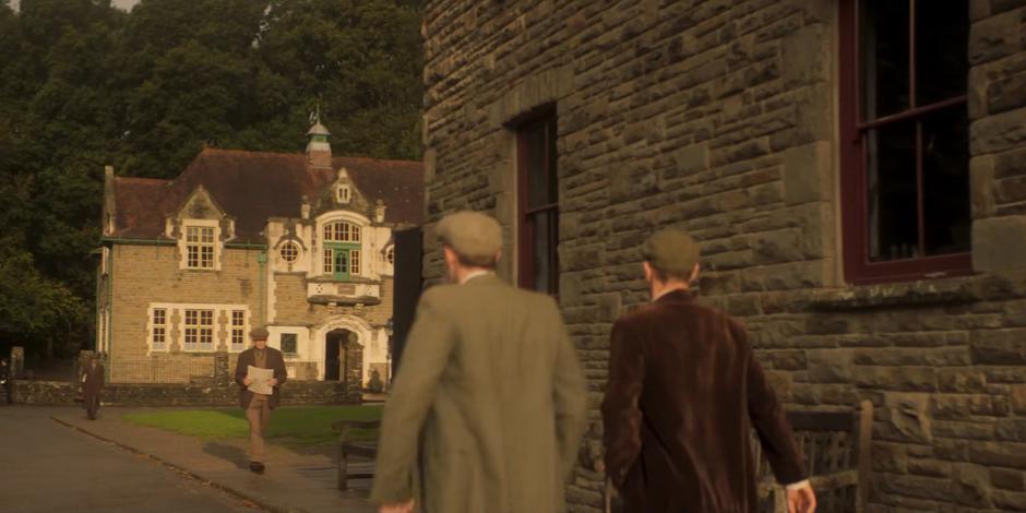 Brendan and Patrick walk through town towards the station.