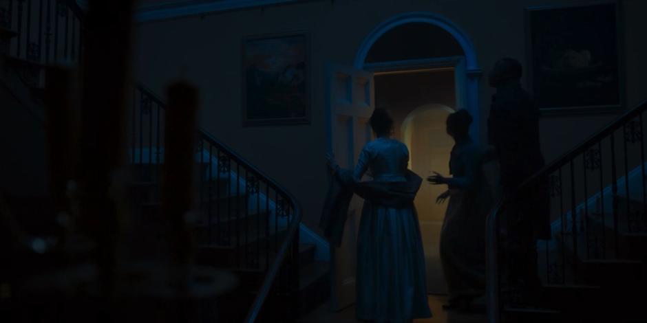 Mary opens the door on the stairs she found without looking and prepares to go inside with Yaz and Ryan.