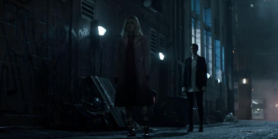 Kate steps out into the alley to talk with Alice.