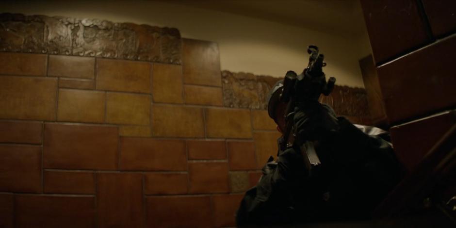 A Crows Security guard turns the corner while climbing the stairs in the lobby.