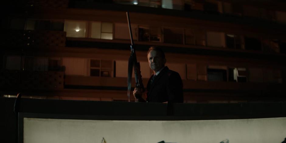 Dr. Ethan Campbell raises his rifle after shooting Beth.