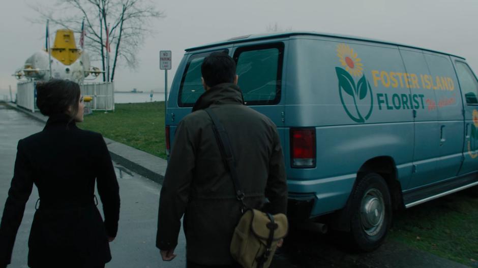 Abigael and Harry walk around the abanonded florist van.
