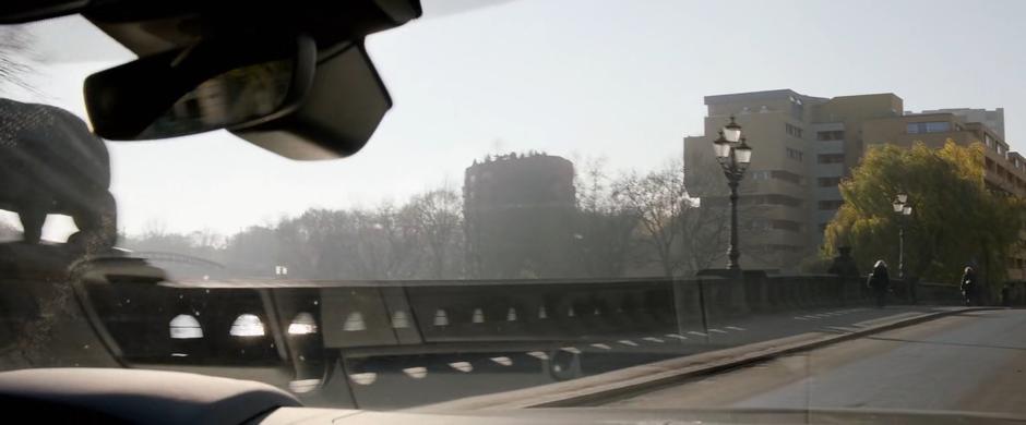 Bosley drives across a bridge on her way across Berlin.