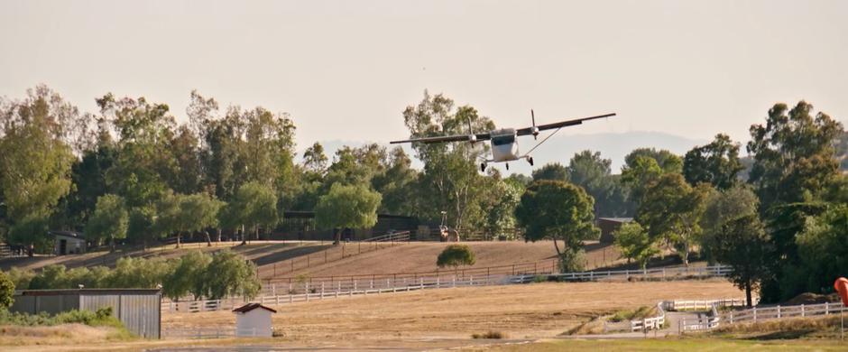 The skydiving plane flies in low for landing.