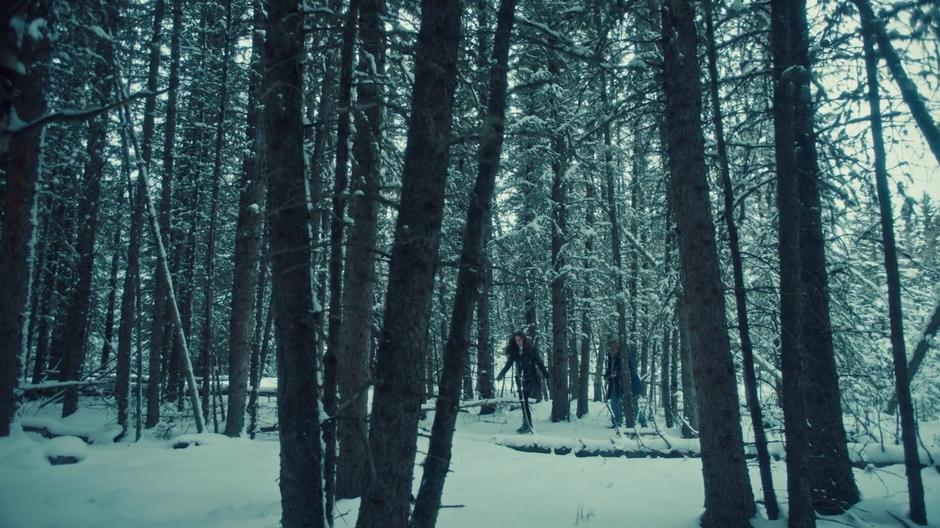 Wynonna walks through the fresh snow with Nedley looking for the stairs.