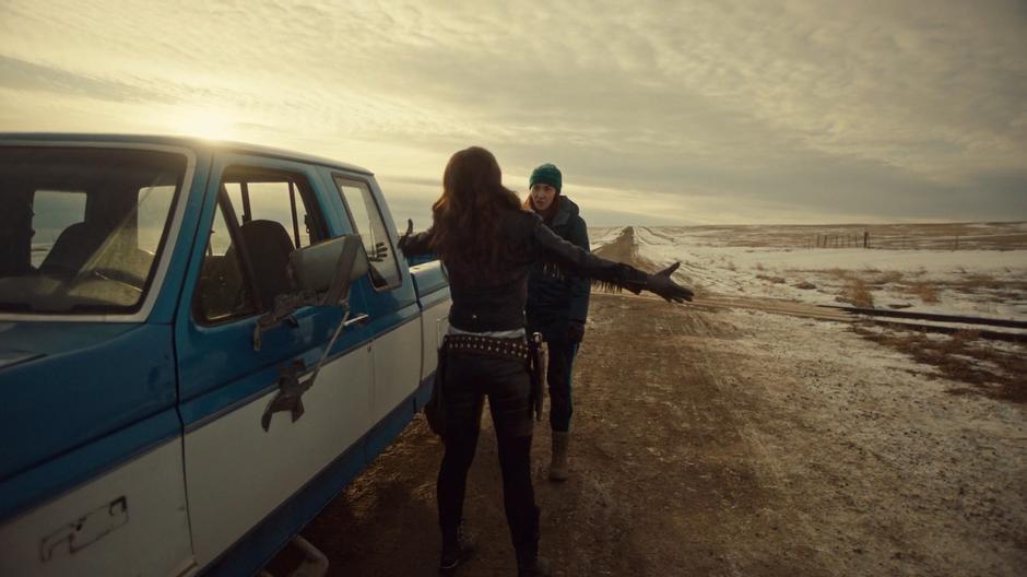 Wynonna spreads her arms to hug Nicole.