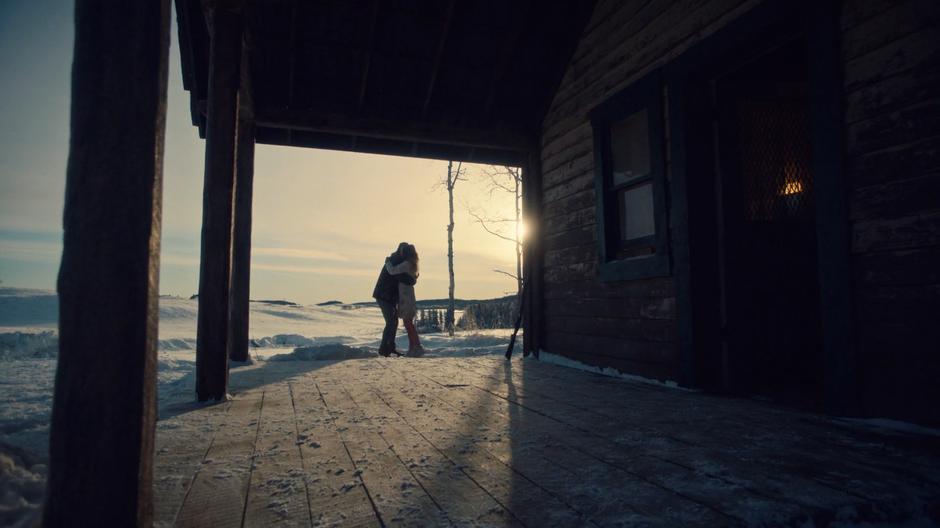 Nicole desperately hugs Waverly on the back porch of the house.