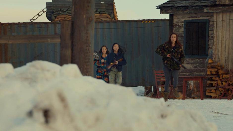 Waverly, Rachel, and Nicole race to check on the trap.