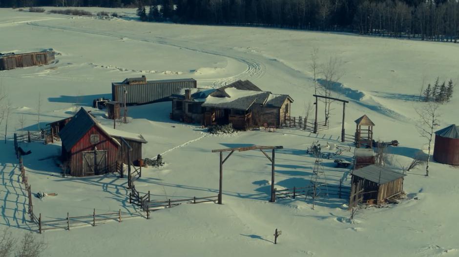Aerial view of the Homestead covered in snow.
