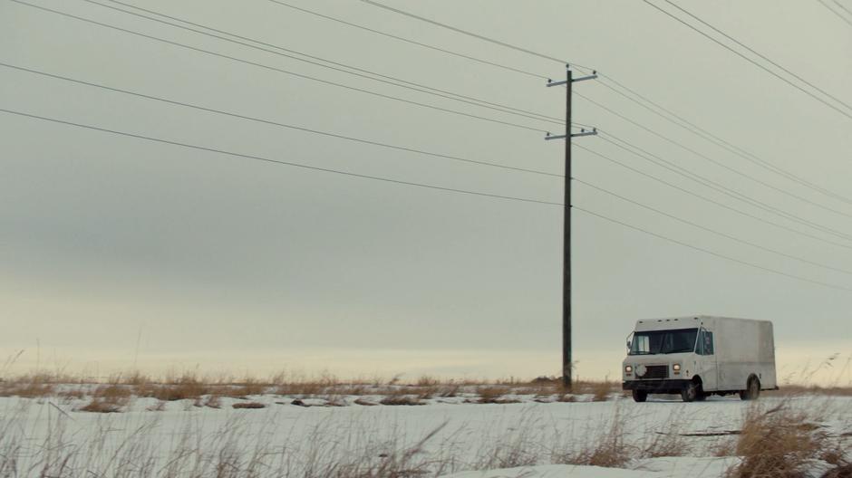 The BBD delivery truck heads down the road towards town.