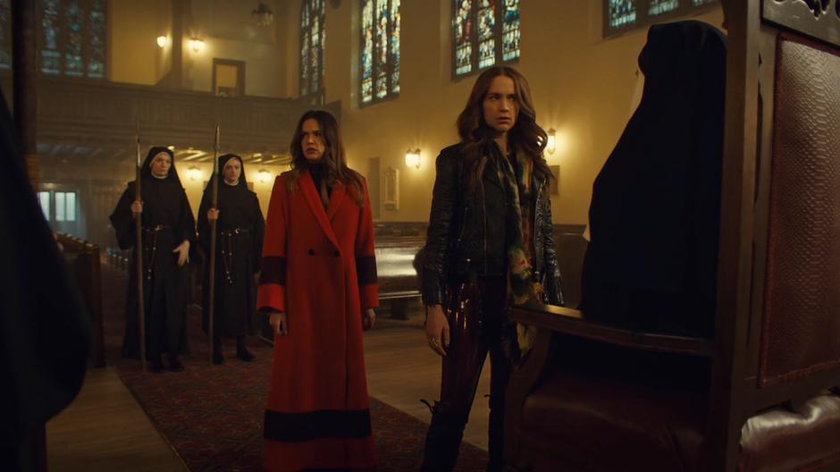 Rosita and Wynonna look around when the nuns surround them with spears and the nun-in-charge starts getting weird.