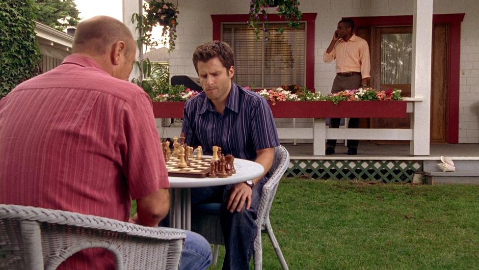 Gus yells at his parents over the phone while Shawn and Gus play another chess game.