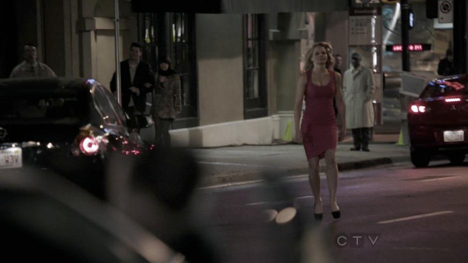 Emma calmly walks after the man.

From the pilot.
