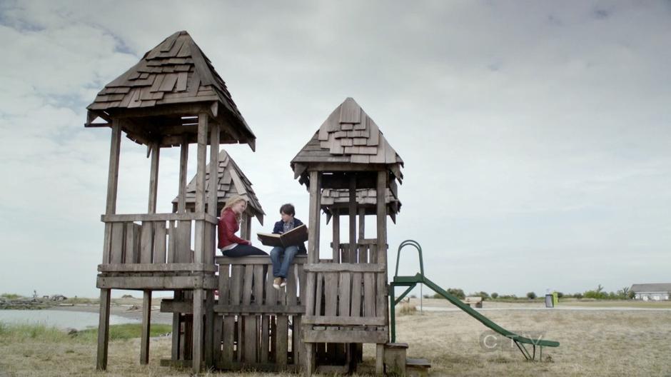 Emma and Henry talk at the castle playground.