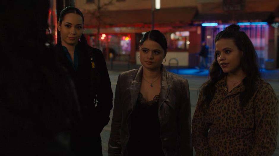 Macy, Mel, and Maggie convince the bouncer that they are part of the ex-witch group.