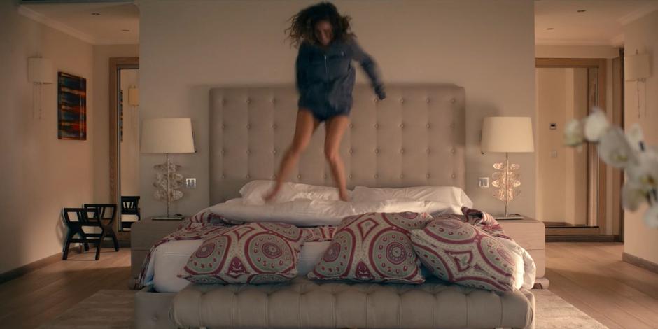 Ava jumps up and down on her bed after realizing the previous day wasn't a dream.