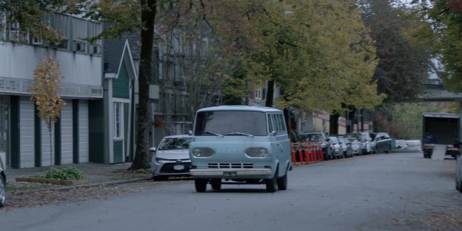 Ryan and Mary drive down the street in Ryan's van.