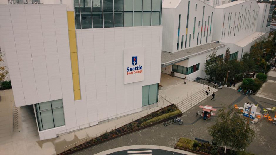 Students walk around outside the college in the morning.