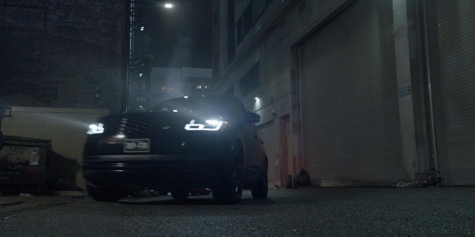 Mary and Luke pull into the alley in their car.