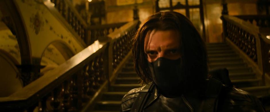 Bucky walks towards his target in his angry Winter Soldier look.